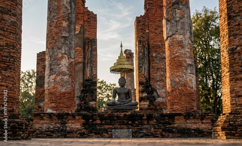 Buddha Statue in Ancient Temple Ruins with Floating Lantern Festival at Night Thailand