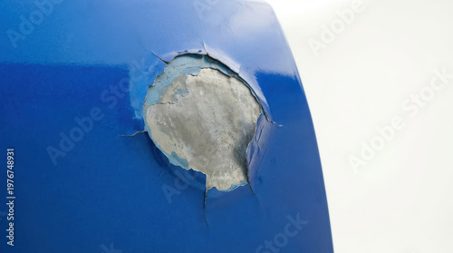Car insurance accident estimate damage repair concept on blue metal dent peeling paint closeup texture detail