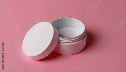 A white open container on a pink background with a clean design
