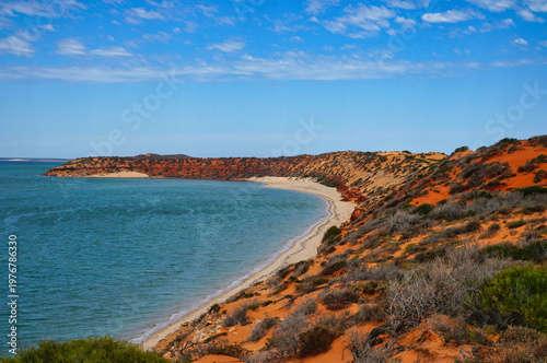 Skip Jack Point red sand dune coastline with turquoise bay and sandy beach