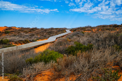 Skip Jack Point boardwalk through red sand dunes under blue sky