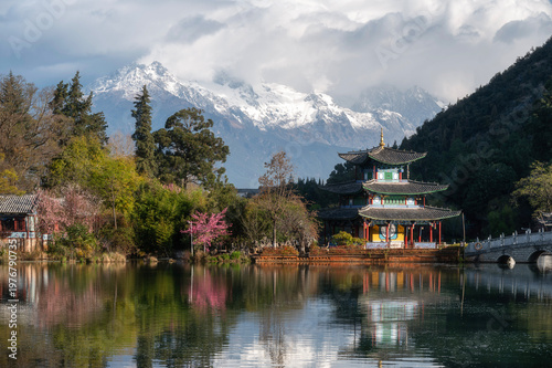 Heilongtan, Black Dragon Pool Garden with Moon Embracing Pavilion and Yulong Snow Mountain in the backdrop, Lijiang, Yunnan, China