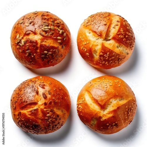 Overhead shot of four round, crusty bread rolls