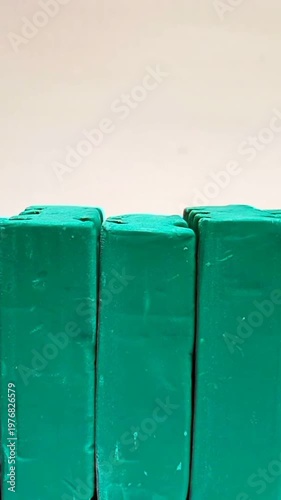 Green Dishwashing Soap Bars Moving in a Line, White Background Stock Footage, vertical clip