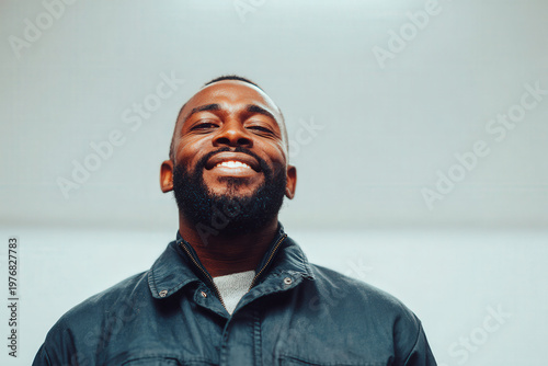 man in glasses is fixing old bicycle in quaint garden surrounded by lush greenery