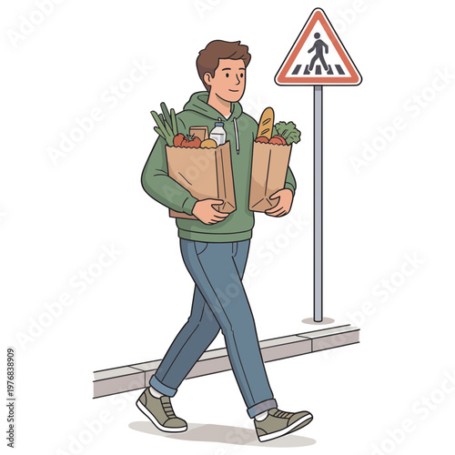 Man carrying grocery bags walks past pedestrian crossing sign on sidewalk