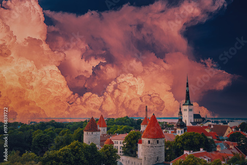 St. Olaf's Church spire and defensive walls under dramatic clouds
