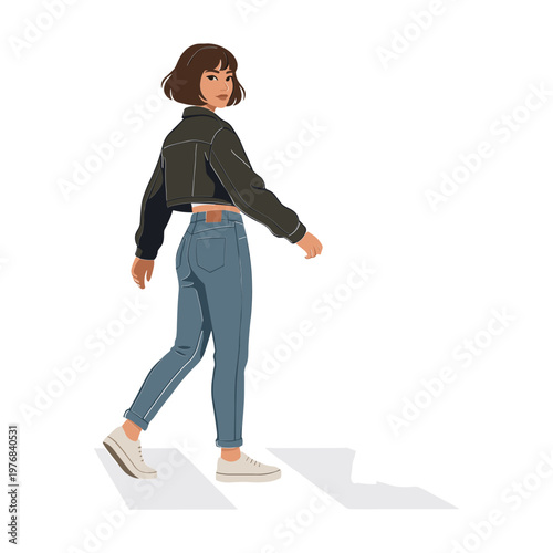 A woman walks alone on a crosswalk wearing casual clothes.