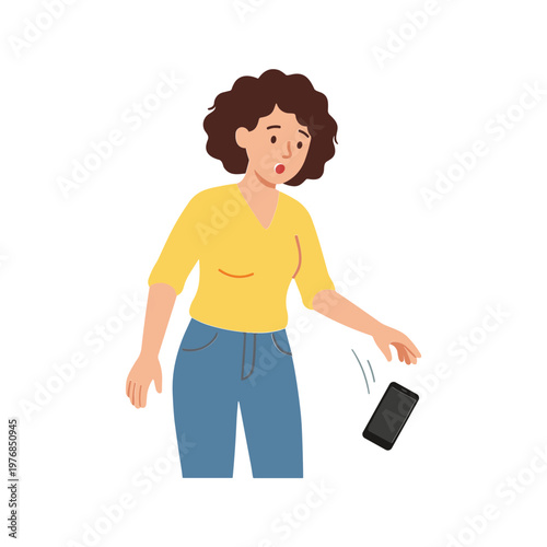 Woman drops phone in surprise while wearing yellow shirt and jeans indoors