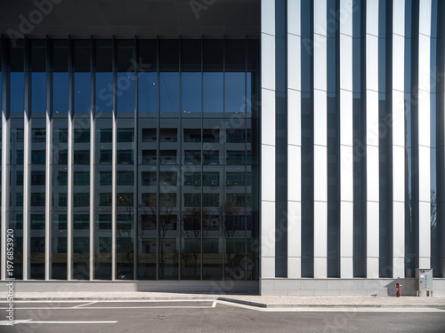 Εκτύπωση καμβά Modern facade with vertical fins and dark glazing in office building
