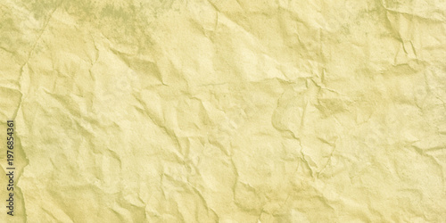 Crumpled yellow paper texture background with creases and wrinkles for design and craft projects