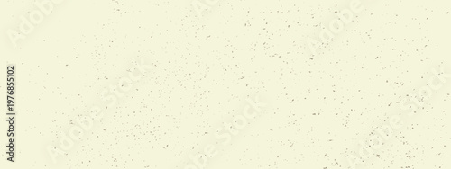 Vintage rice paper background. Grainy texture with speckles, dots and flecks. Organic craft ecru bg.