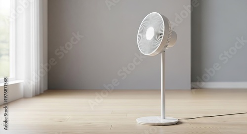 A white electric fan standing alone in a minimalist room with a window