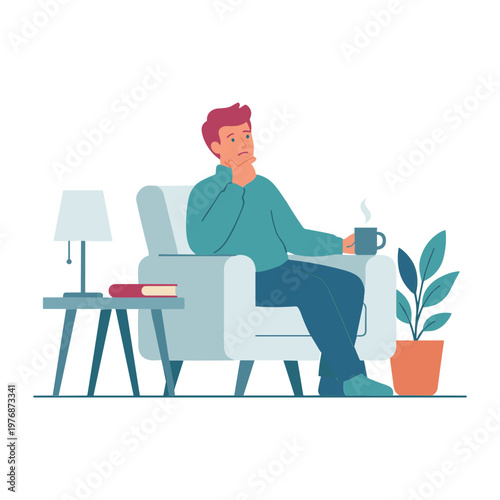 Man sitting in armchair holding coffee cup with book and lamp nearby