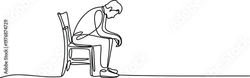 Man sitting on chair with head down looking sad
