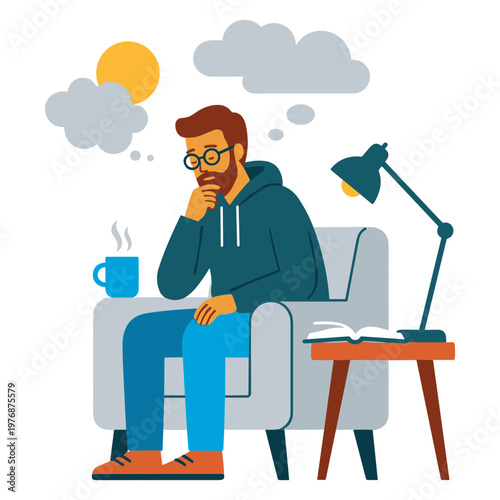 Man sitting on a couch thinking with a cup of coffee and a lamp nearby indoors.