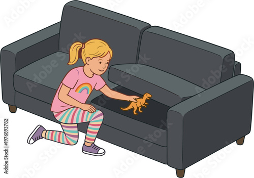 A young girl plays with toy on a dark gray couch indoors