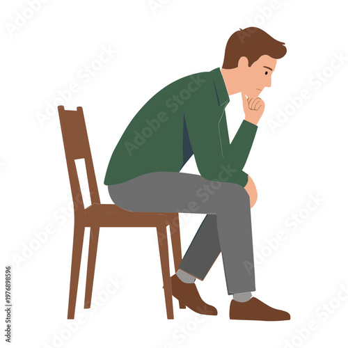 A man sits on a chair looking worried and thoughtful indoors alone
