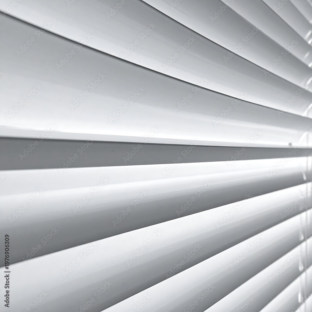 Obraz premium Close-up of white, angled blinds, casting shadows