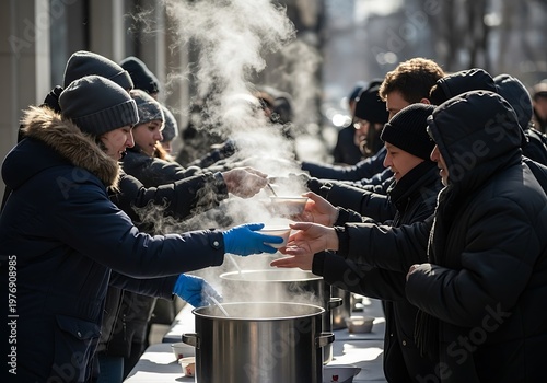 People receiving hot food from a large pot during a community event