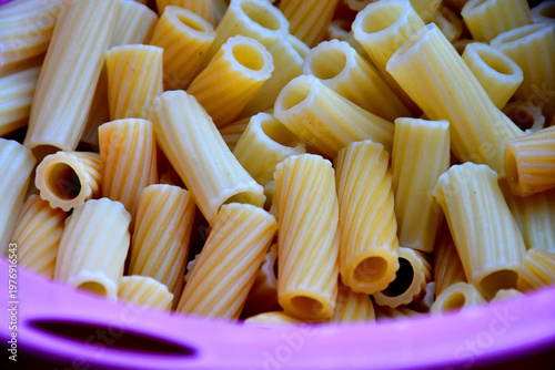 fresh cooked macaroni in a sieve in a closeup