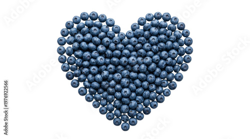 Isolated blueberries arranged in heart shape on white background