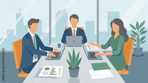 Business professionals working on laptops in a modern office meeting