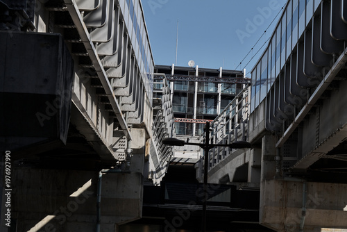 Bild auf Leinwand Elevated rail structure and underpass in dense city neighborhood