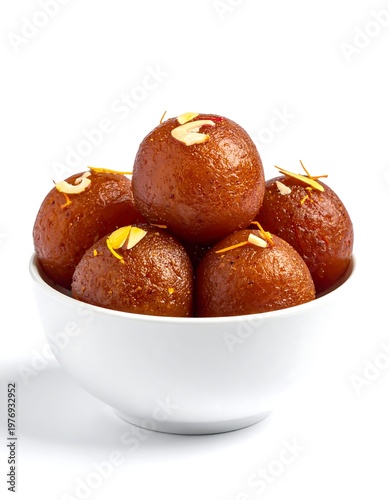 Close-up of a white bowl overflowing with round, golden-brown treats garnished with almond slivers, against a pristine white backdrop