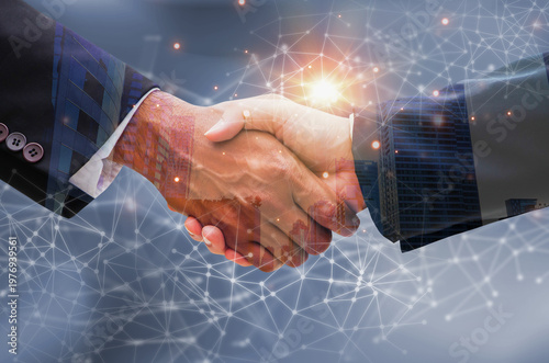 Business professionals shaking hands in a professional networking setting, symbolizing partnership, trust, and collaboration, isolated on black background.