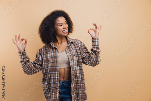 African American woman gesturing okay with both hands