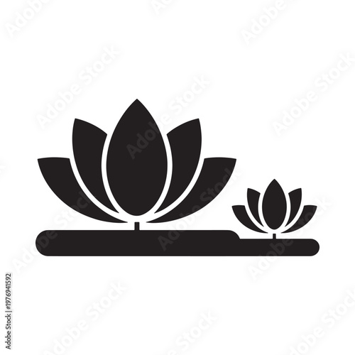 Black silhouette of lotus flowers and lily pads on water