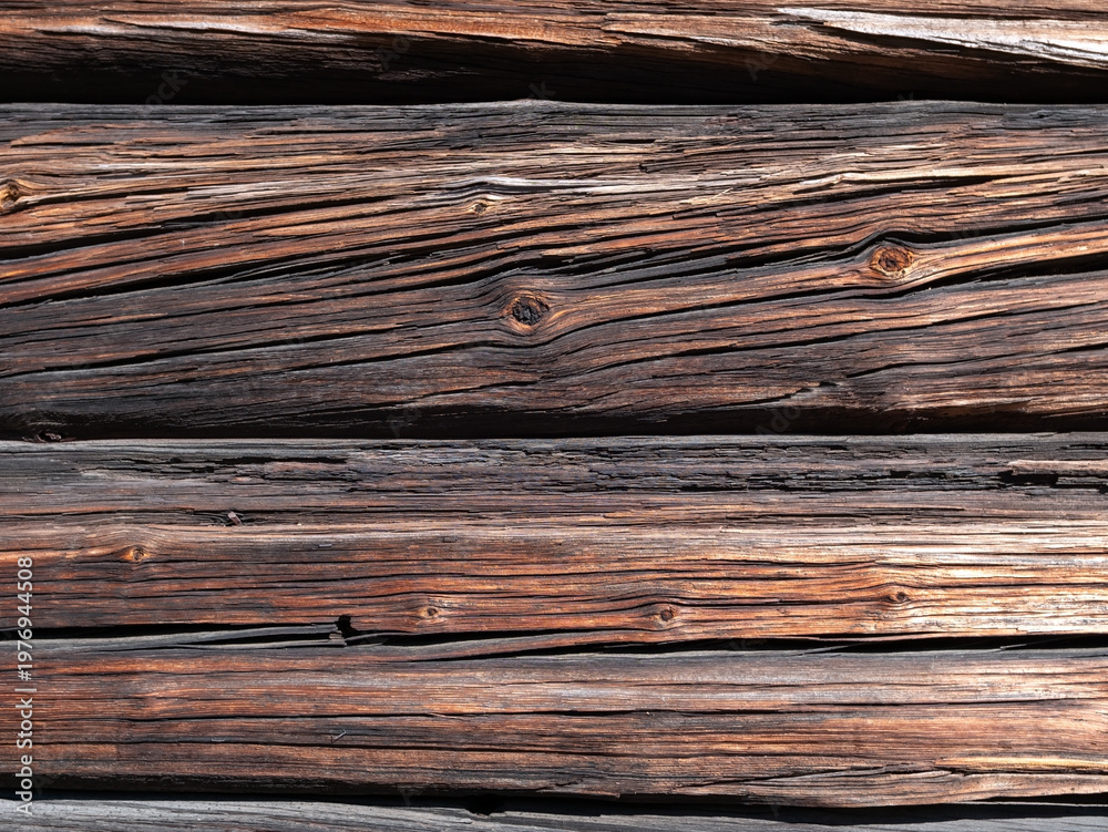 Fototapeta premium weathered old wooden log wall texture background outdoors