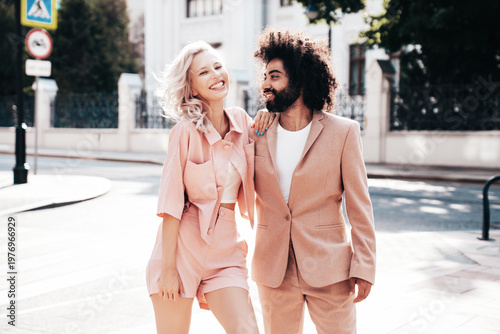 Bild auf Leinwand Beautiful fashion woman and her handsome elegant boyfriend in beige suit