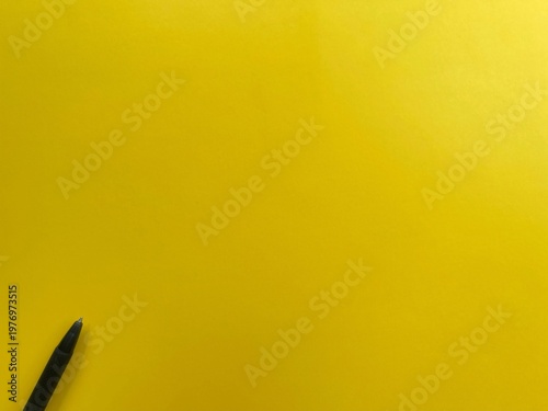 Minimal yellow background with pen and copy space for text, clean layout for creative design and business concepts