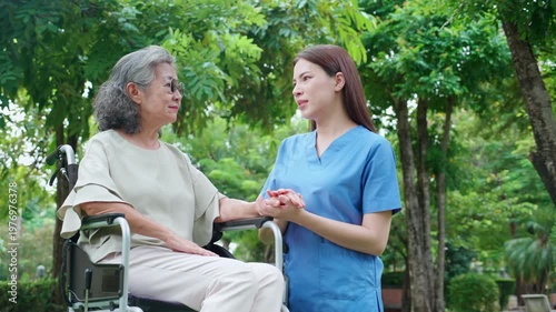 Nurse holding hand senior patient for encourage, assistance and support, caregiver touch hand elderly woman with empathy and comfort, rehabilitation therapy mental health for elderly.