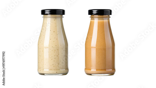 Two glass bottles of sauce on transparent background