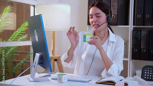 Young asian creative woman development packaging cosmetic and skincare product design with AI artificial intelligence, businesswoman using headset with marketing for conference online, call center.