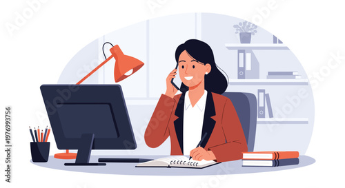 Professional businesswoman talks on a mobile phone while writing in her notebook at a desk with a computer in a bright modern office.