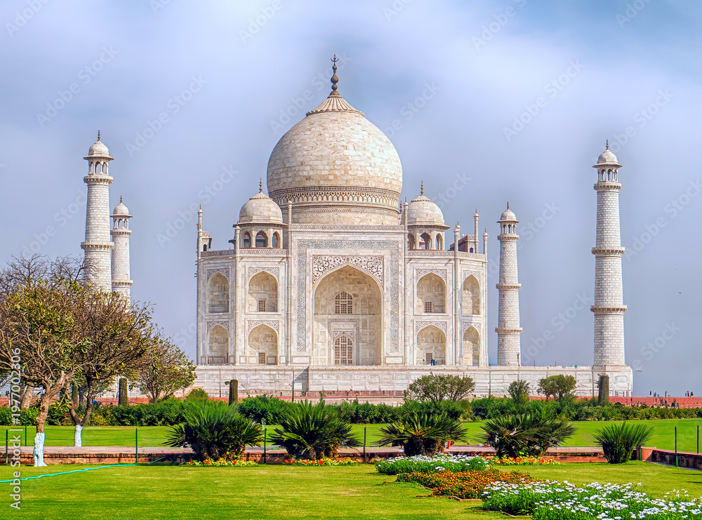 Fototapeta premium Agra, India, 20.02.20. Iconic white marble mausoleum with symmetrical garden