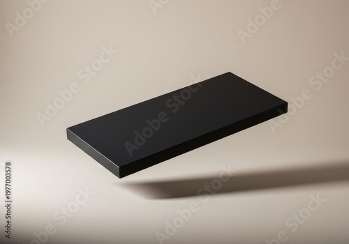 Simple composition showing a floating dark rectangle against a pale textured surface. Clean lines and deep shadows emphasize form, light, basic, background