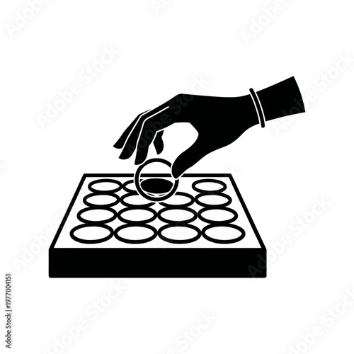 The hand of a scientist placing a sample on a 96-well plate