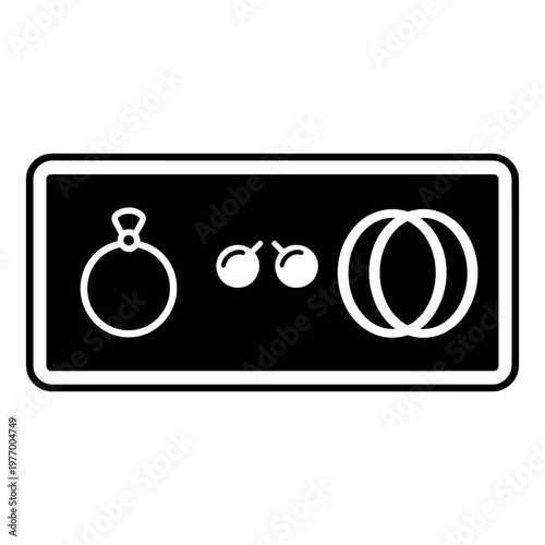 Accessories, ring, earrings, and wedding bands inside a black rectangle