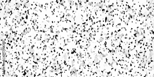 Black and white terrazzo texture seamless pattern with dark stone chips on light marble. A densely speckled abstract texture with varying shades of gray and black against a white background