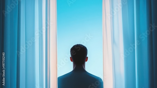 Soft backlight outlining the silhouette of a person near a window.