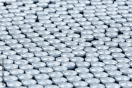 Stack of aluminum beer cans forming repetitive industrial