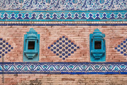Detail view of brick and blue ceramic tiles decor on ancient medieval Baha'al Halim tomb, Uch Sharif, Bahawalpur, Punjab, Pakistan
