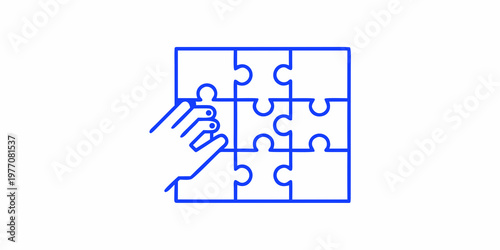 A hand inserting the final piece into a blue line puzzle