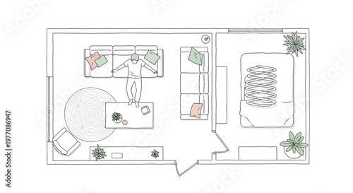 Overhead view of a man relaxing in a modern studio apartment living room and bedroom