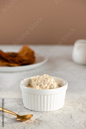 Plant based cashew ricotta with gluten free crepes, clean eating dairy free breakfast. Vertical orientation.